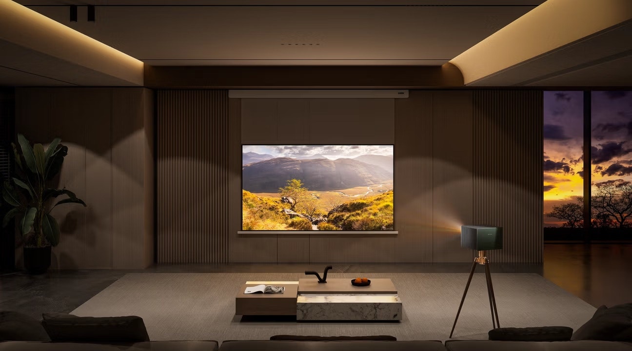 A modern living room setup featuring a 4K laser projector on a tripod projecting a vibrant landscape, demonstrating how to build a home cinema.