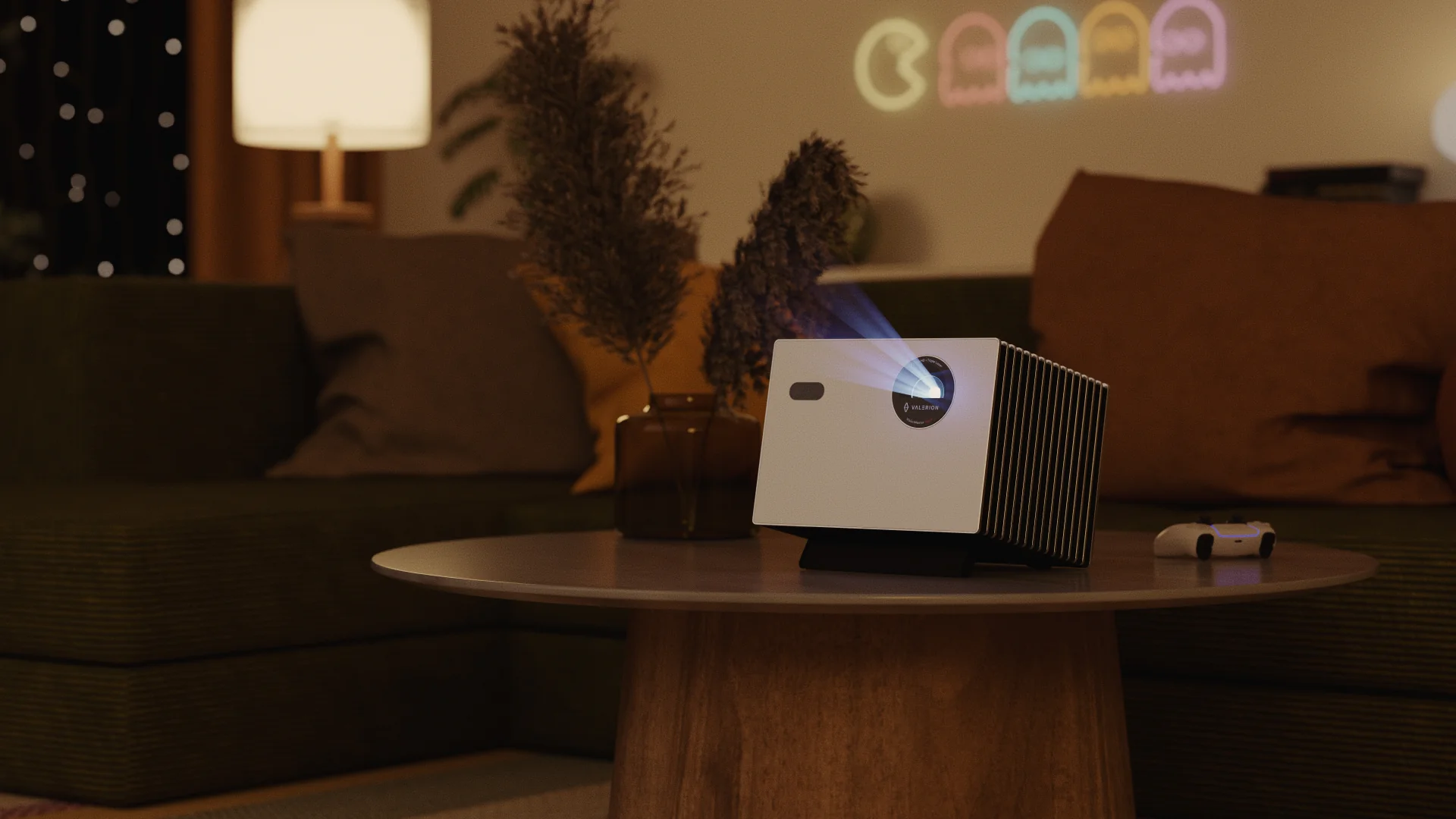 Valerion StreamMaster Plus 2 projector on a table in a cozy living room, projecting a game on the wall.