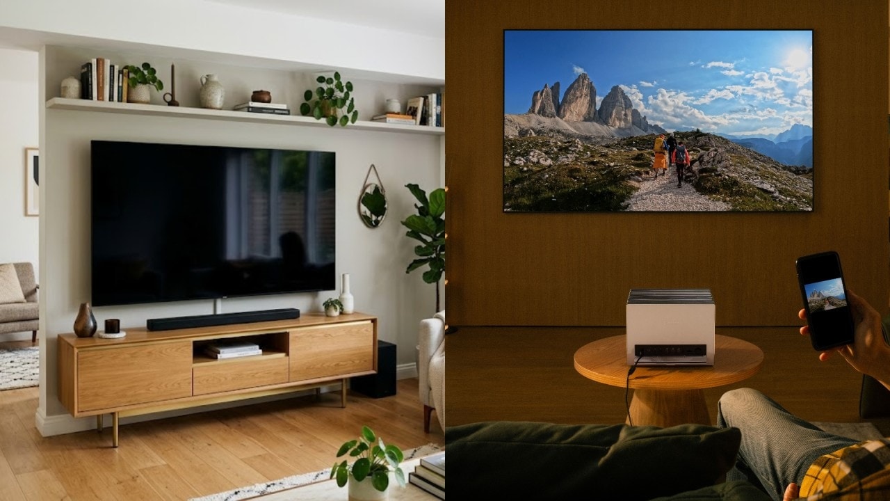 Vergleich im modernen Wohnzimmer: Ein riesiges Valerion Beamer-Bild gegenüber einem herkömmlichen Fernseher.